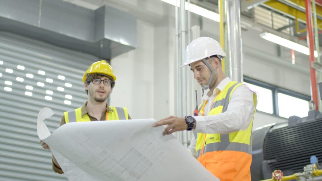 Mechanical engineer preparing for a job interview with safety documents and certifications