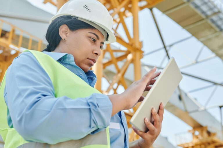 Female engineer inspecting equipment at a COMAH facility